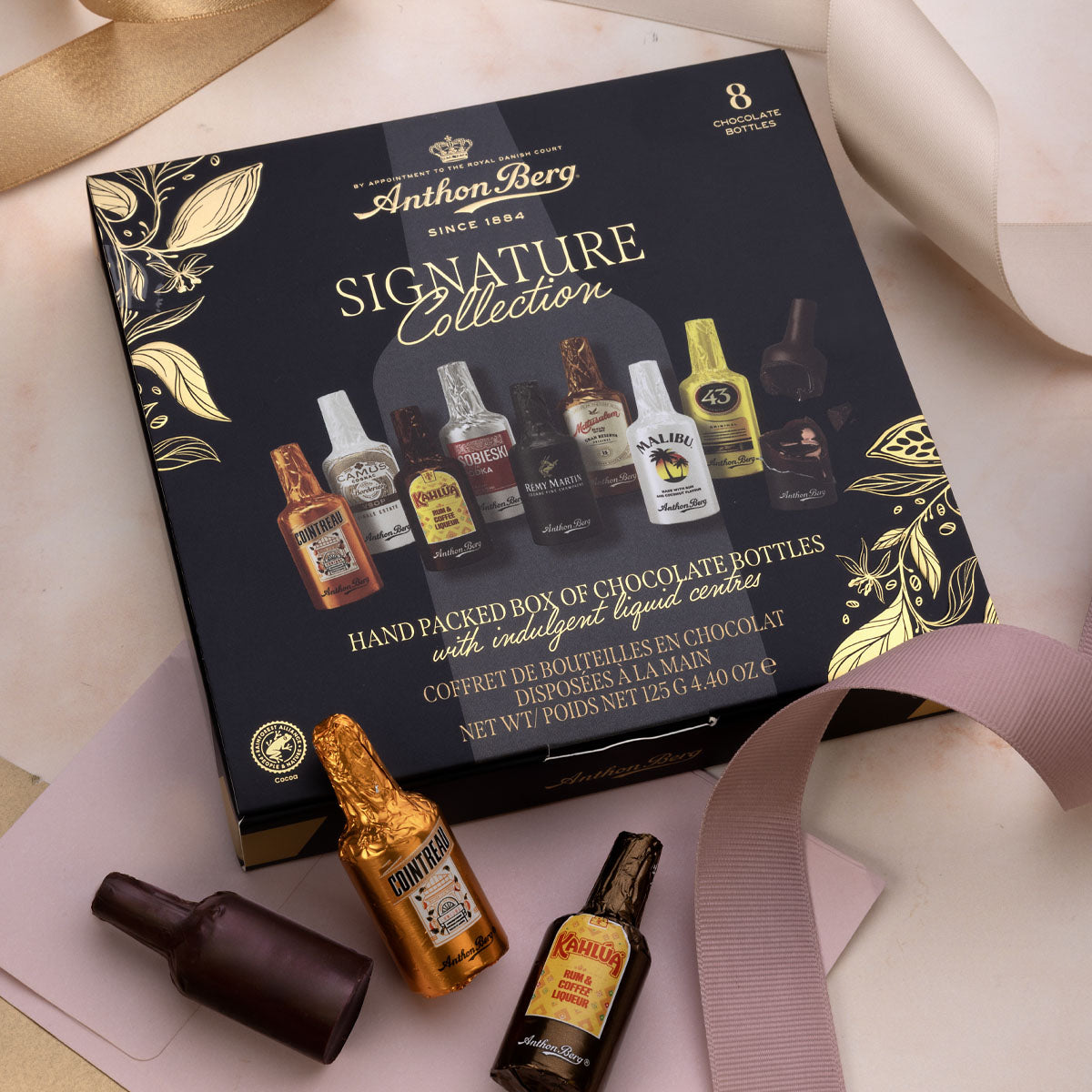 Confezione regalo | 8 bottigliette di cioccolato e liquori assortiti | 125g | Cartone con 14 pezzi